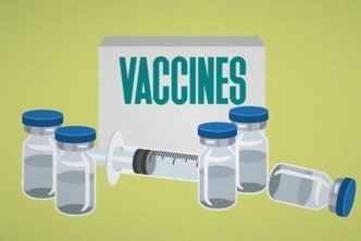 Vaccine bottles and needles