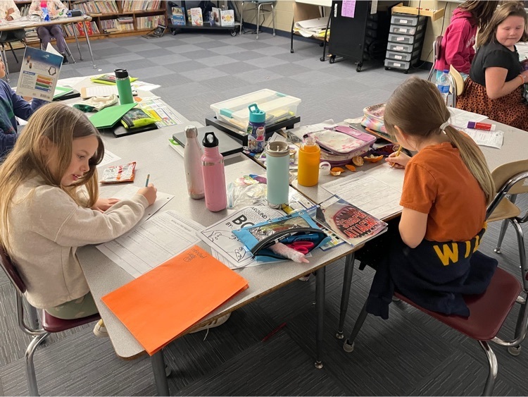 students writing in a 2nd grade classroom.  