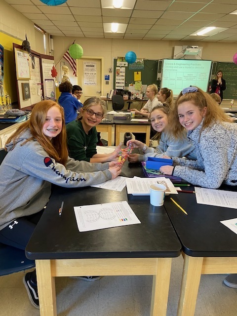 8th grade students construct a DNA model